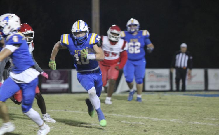 Bethel senior Luke Quinter makes his way to a touchdown during the Oct. 31 homecoming game, after escorting Homecoming Queen Lilly Jordan. The Wildcats won against Okmulgee 46-0. File photo by Natasha Dunagan, Countywide & Sun