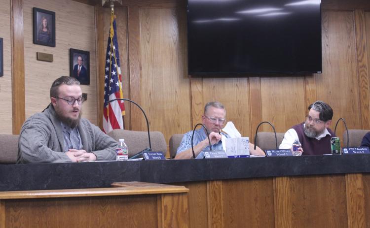 Shawnee Board of Education member Turner Bass asks questions about the incident which led to Cyndi Berger's removal from school premises before voting no on the superintendent's recommendation during a Special Session on Nov. 20. Also shown are Russ Oliver and Board President Clif Harden. Natasha Dunagan, Countywide & Sun