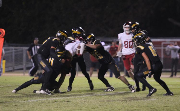 The Tecumseh Savage defense works to bring down the Tuttle ball carrier in the second quarter of the Oct. 16 home game against Tuttle. File photo by Natasha Dunagan, Countywide & Sun