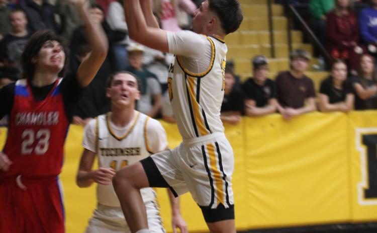 Tecumseh senior Creed Wright goes to the hoop and draws the foul during the Dec. 5 home game. Natasha Dunagan, Countywide & Sun