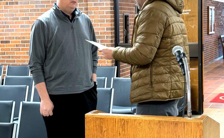 Tecumseh City Attorney Nic Atwood swears in new Ward 3 Councilman Christopher Abel after the special meeting held on Jan 12. Julie Talton, Countywide & Sun