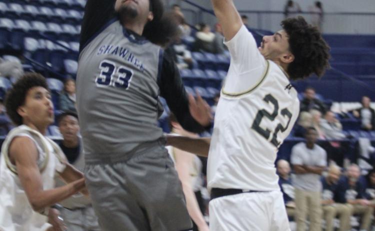 Shawnee senior Aidon Siqueiros tries for a basket during the Shawnee Invitational on Jan. 22. Siqueiros reached 1,000 high school career points this year. Natasha Dunagan, Countywide & Sun