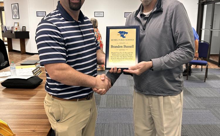 Brandon Bussell (pictured left) is presented a plaque by Superintendent Dr. Matt Posey (right) for his 10 years of service on the Bethel School Board. Suzie Campbell, Countywide & Sun