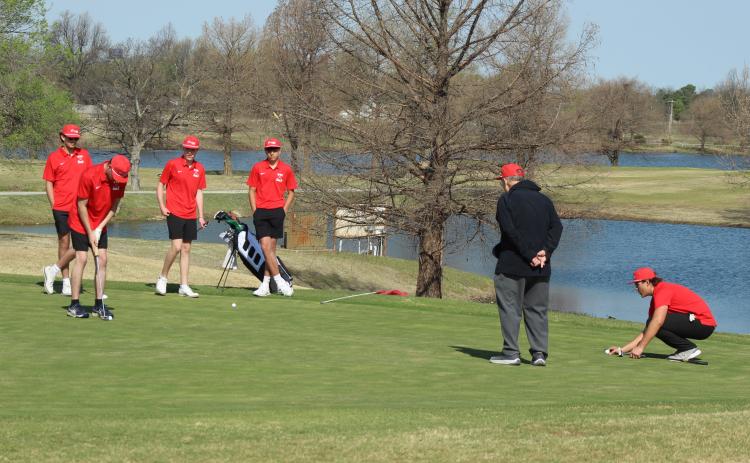 The North Rock Creek Cougar JV golf team is shown at the ninth hole during the North Canadian River Valley Conference Tournament, held at the Elks Golf Course in Shawnee on March 24. They are, from left, Parker Ramsey, Maddox Taulman (putting), Carson Simmons, Haygen Eubanks, Assistant Coach Don Sumner and Ryder Adams. Tecumseh, Bethel and McLoud also participated in the event, and the NRC Lady Cougars placed first as a team, according to a Facebook post on the NRC Public Schools page.