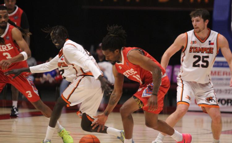 Potawatomi Fire guard Jahmal McMurray gets caught stealing the ball, before adding two points, during the April 3 home game against the Dallas Stampede. The Fire were victorious, with a final score of 131-89. Photos by Natasha Dunagan, Countywide & Sun. Click on the camera banner ad below to see all our photos from the game!