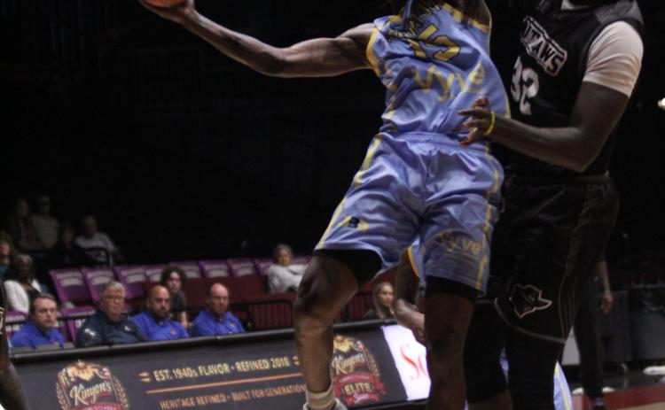 Potawatomi Fire Forward Jay Hedgeman goes to the hoop and is fouled in the third quarter of the May 14 home game against the Enid Outlaws. Hedgeman made 22 points and 11 rebounds for his second double-double this season. See full cutline below.