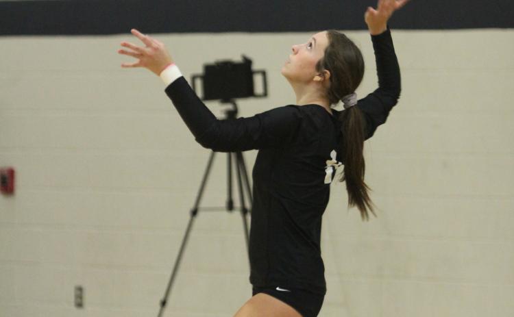 Tecumseh senior, libero Kayley Wood keeps her eye on the ball as she serves during the Shawnee Volleyball Invitational Silver Bracket game against Harding Charter, held at Shawnee Middle School on Sept. 20. File photo