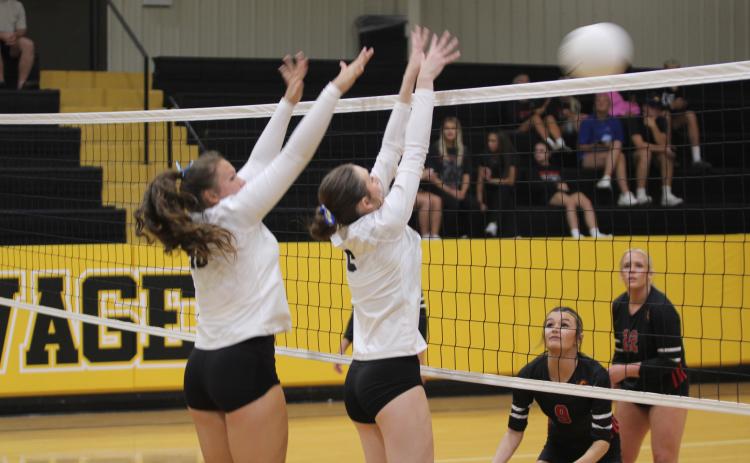 Tecumseh sophomores Aivah Dodgion and Kenda Whittington block the ball in the home match against North Rock Creek on Aug. 28, 2025. File photo
