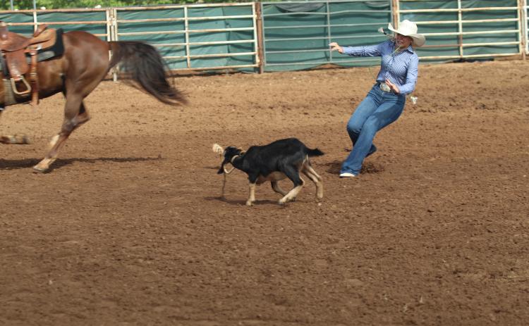 After dismounting from her horse, Rianne Tinsley of Bethel runs to a tethered goat to tie it during the International Finals Youth Rodeo on July 16. Photos by Natasha Dunagan, Countywide & Sun