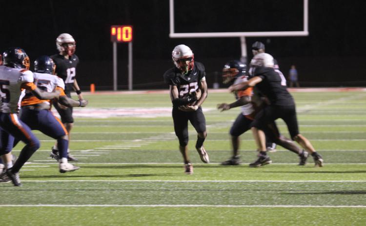 McLoud sophomore Marcus McKee starts his run on the way to a touchdown.