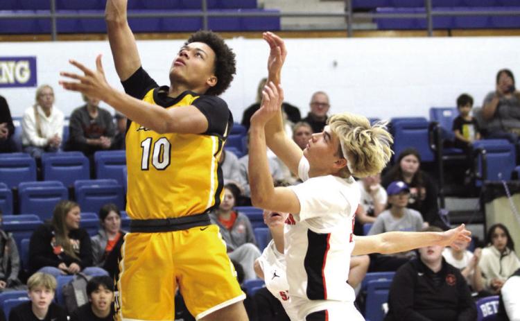 Tecumseh’s Jekhi Owens takes it to the hoop in the first quarter of the Bethel First United Tournament Consolation Championship with Sallisaw on Dec. 14. The Savages lost to Pauls Valley, 60-62; beat Bethel, 71-52; and fell to Sallisaw, 60-79. Countywide & Sun/Natasha Dunagan