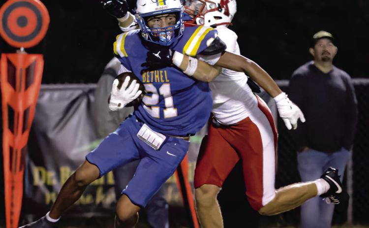 Bethel sophomore Dallas "Dre" Fixico carries the ball, as a Kiefer defender tries to take him down, during the home game on Oct. 2. Photos courtesy of Richelle Treece
