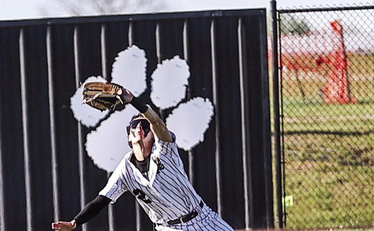 NRC's Owin Payne makes a diving catch in right field for the out. Photos courtesy of Gowin Photography
