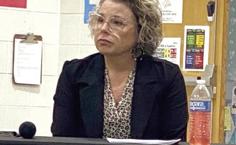 Assistant Superintendent, Brandi Burks listens to Robert Kinsey address the board during the Superintendent’s report. Countywide &amp; Sun/Julie Taton