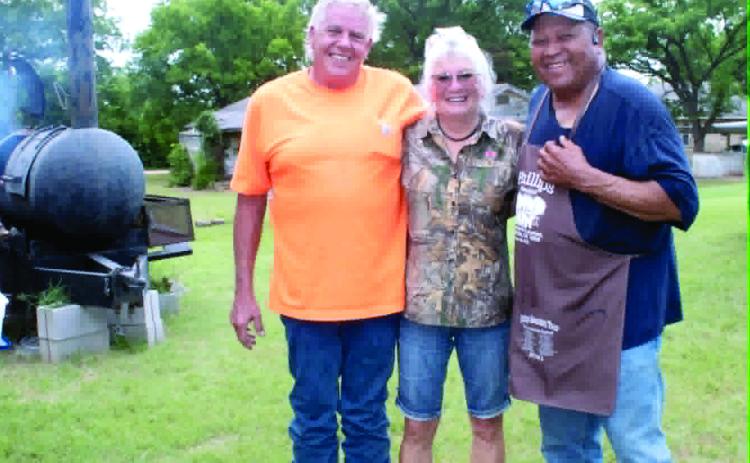 Ronnie and Joy Deatherage, with Carter's Beef in Tecumseh, pose with Frank Phillips of Brooksville. Carter's Beef donated 100 pounds of hamburger for the fundraiser, held at the Brooksville Community Center on June 20. J. Deatherage said the Brooksville community bought a quarter side of beef worth $1,134 for a drawing to raise money for the Brooksville Cemetery pavilion and restroom. Michael Watters won the drawing, and the event raised about $3,000. Photo courtesy of Ashaley Crawford