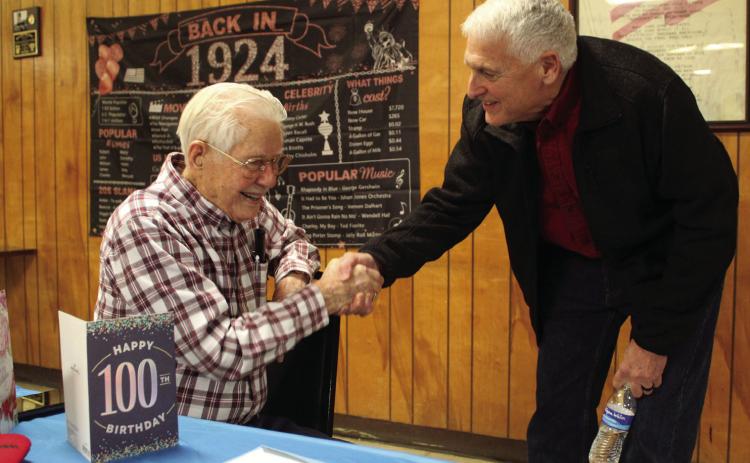 Shawnee Mayor Ed Bolt, right, wishes Noah “Sonny” Hines a happy 100th birthday at the Veterans of Foreign Wars Post 1317, Feb. 5. Hines said he has also had parties at his church and with his fellow “railroaders,” and his family and friends will be celebrating at a Shawnee restaurant later that month. File photo