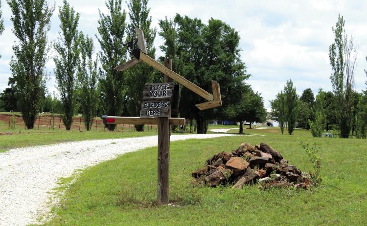 A sign along the entryway to Serenity Hollow Retreat Center says "Place you burdens here," and the opposite side says "Leave your burdens behind." The 40-acre women's retreat is located at 20425 Kings Road and offers well-being workshops, walking trails, four themed bedrooms with adult bunk beds and an outdoor event area, as well as goats, donkeys and two dogs. Photos by Natasha Dunagan, Countywide & Sun