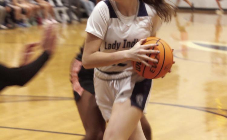 Asher's Makenah Templeton drives to the basket and gets a foul during the Nov. 7 home game against Paden.