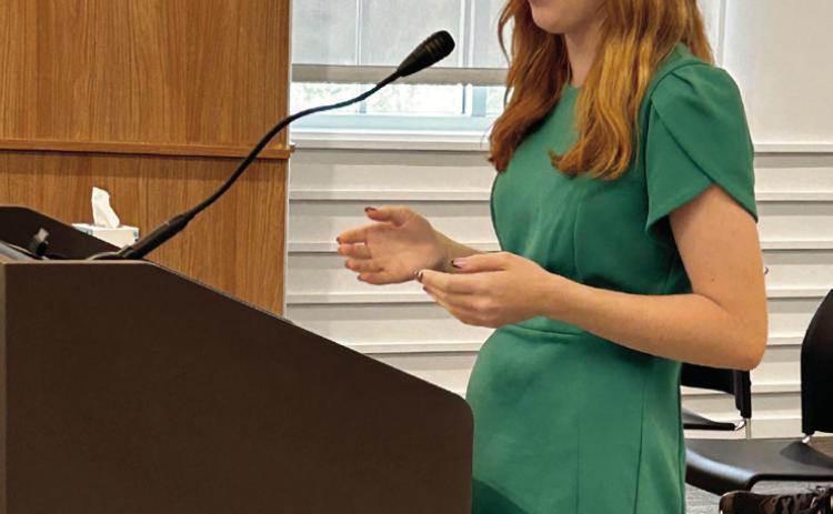 Kimberly Holland speaks to the commission about 4-H Hall of Fame photos. Photo by Suzie Campbell, Countywide &amp; Sun