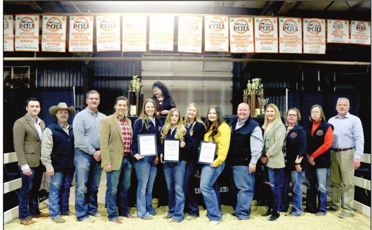 Four high school seniors were aeach warded $2,000 scholarships at the PCJLS Premium Auction. Pictured from left: Matt Blubaugh with the office of US Rep Stephanie Bice , Rep. Danny Sterling, Rep. Ronny Johns, Sen. Shane Jett, Emily Bingham - Tecumseh FFA, Makinzie Odell - Asher FFA, Allie Brown-Asher FFA, Whitlee Davis, - Tecumseh FFA, Rep. Dell Kerbs, Dist. 1 Pottawatomie County Commissioner Melissa Dennis, Mandy Hasbell, Gina Rounsaville, and Jeremy Frye.
