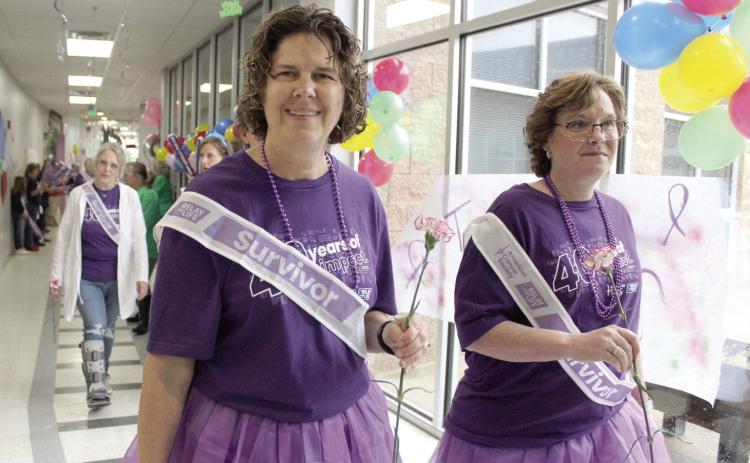 Cancer survivors Tina Thompson and Tiffany O'Neal walk the first lap of Relay for Life, held at Shawnee Early Childhood Center on the afternoon of April 26. Natasha Dunagan, Countywide & Sun