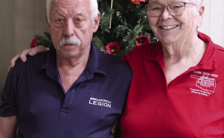 American Legion Post 260 Commander and Navy Veteran Tom Snodgrass and Donna Snodgrass, American Legion State Auxiliary 1st Vice President, pose by the 'poppy tree' at the Tecumseh post. Natasha Dunagan, Countywide &amp; Sun