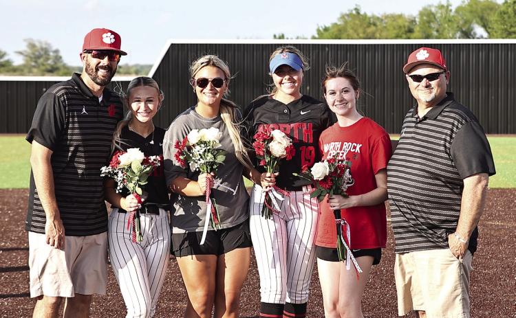 Coach Ray & Coach Cox celebrate with the seniors, Laynee Joyner, Jaxtyn Ratcliff, Sophie Morris and Emma Degman after the double win against Lexington on April 13. Photo Courtesy of Gowin Photography