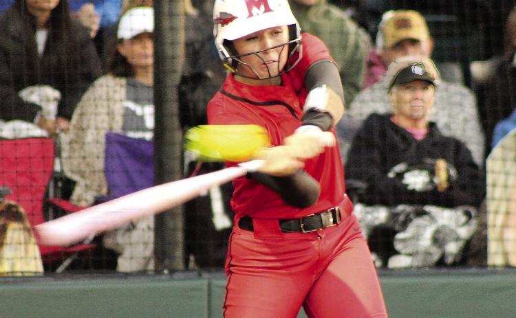 McLoud's Avery Soward swings in her turn at bat during the first inning.