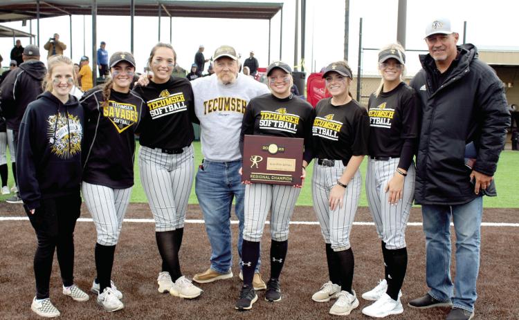 Tecumseh High School Principal Randy Dilbeck, center, and Athletic Director Jeff Shafer, far right, pose with the Lady Savage Seniors after the Class 5A Regional Championship on April 28 at FireLake Ball Fields. Shown are, Steeli Mitchell, Taylor Gage, Blakeley Sanchez, Dilbeck, Cadence Oliver, Bristin Hayes, Katelyn Fleming and Shafer. Countywide & Sun/Natasha Dunagan