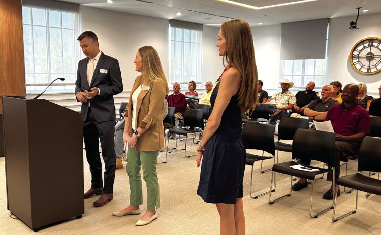 Pictured from left, OKCPhil Executive Director Brent Hart, Education and Community Engagement Director Shannon Lockwood, and the President of the Orchestra League Rachael Geiger, address the Board of County Commissioners regarding a Christmas concert to be held in Pottawatomie County. Suzie Campbell, Countywide & Sun