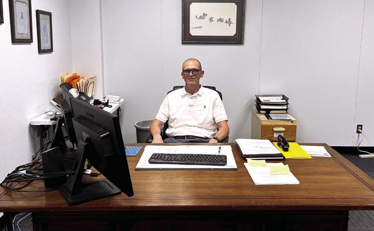 Bethel's new superintendent, Mr. Jerry McCormick, has begun moving into his office. The vintage desk he sits behind has a story to it, and he is happy to share why it is a special piece of furniture. Suzie Campbell, Countywide & Sun