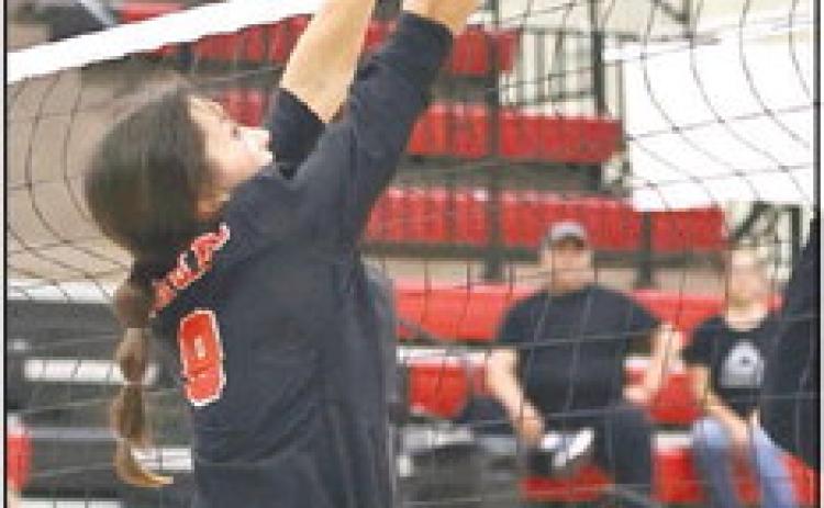 North Rock Creek’s Mya Wong defends the net with a block.