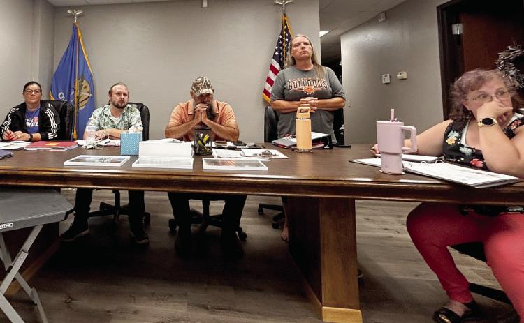 Wanette Trustee Kristina Brock (standing) closes her agenda notebook and gathers he belongings as she prepares to leave during the heated discussions early in the meeting. She did eventually sit back down and finish the meeting. However, the Wanette receptionist did leave the meeting. Pictured, from left, are trustees Jennifer Sanders, Matthew Goad, Mayor Nathan Gregory, Trustee Brock, and Clerk/Treasurer Angela Larman. Suzie Campbell, Countywide & Sun