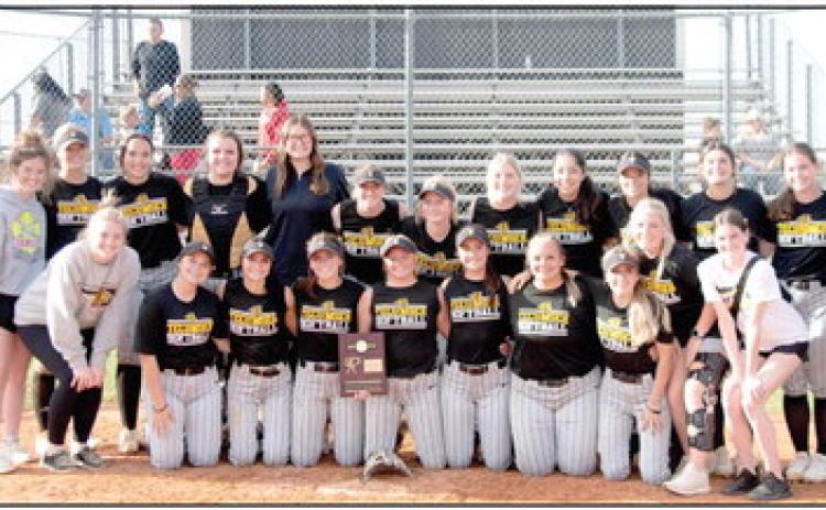 The Tecumseh Lady Savages Slow Pitch Team and their coaches pose after winning the Class 5A District Tournament, held at Tecumseh on April 20. They played two games against Little Axe and won both, 12-4 and 9-0. Photo provided by Kenetta Lisenbee.