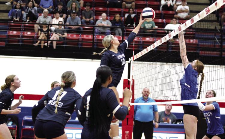 Shawnee's Harlee Bullard makes a block during the OSSAA Class 5A Volleyball State Tournament quarterfinals against Mount St. Mary, held at Moore High School on Oct. 24. The Lady Wolves lost, 0-3. They end the season with a record of 28-11. Countywide & Sun/Natasha Dunagan
