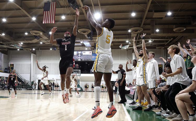 Oklahoma Baptist University’s junior Ricky Brown launches a shot from outside the 3-point circle. Photo provided