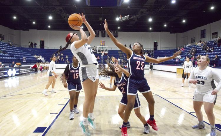 Senior Serenity Whipkey shoots two in the Feb. 14 game against Nathan Hale. The Lady Wolves dominated the court with a 59-3 win. Countywide & Sun/Julie Talton