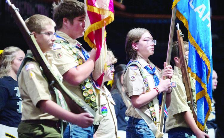 Members of Scout Troops #417 and # 477 Color Guard present the colors during the opening ceremony. Photo by Jesse Monday Media