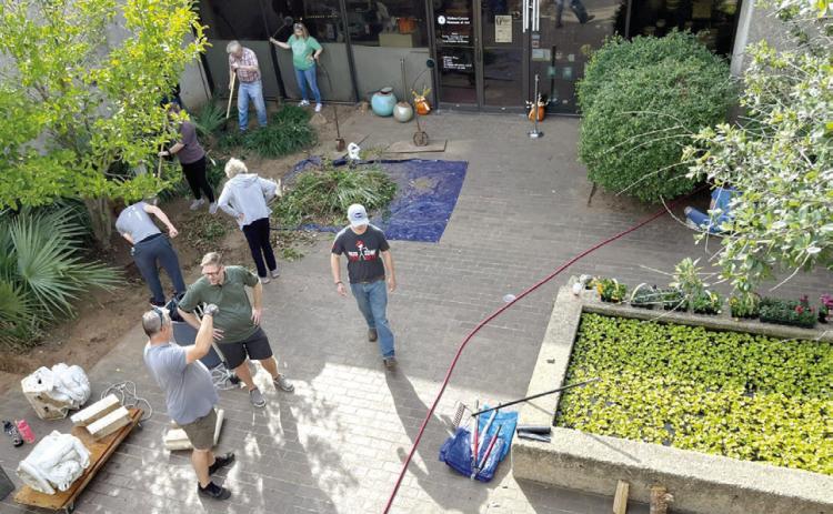Boy Scouts of America Troop 75 and volunteers out of Moore, OK renovate the courtyard at the Mabee-Gerrer Museum of Art. Photo provided