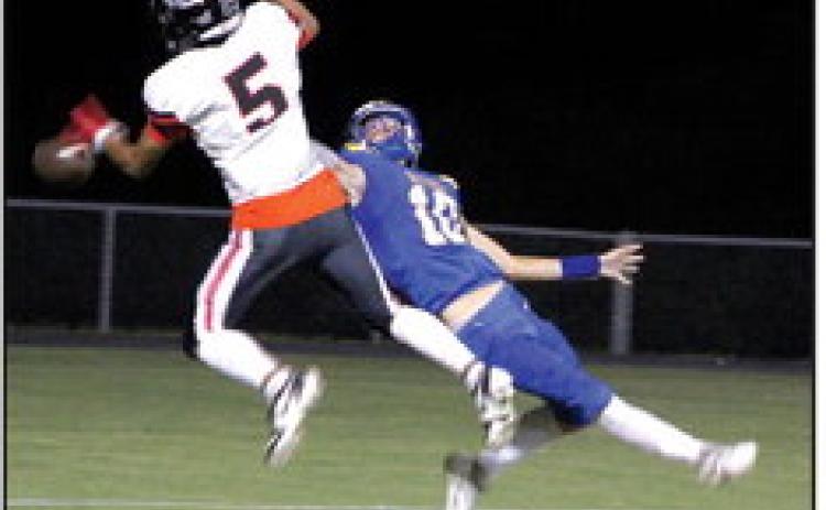 Bethel senior Reagan Curry (#10) tries to catch a pass, as Meeker junior Manny Saavedra (#5) intercepts it, during the third quarter of the Sept. 22 Bethel district home game. Meeker won, 46-7. Countywide &amp; Sun/Natasha Dunagan