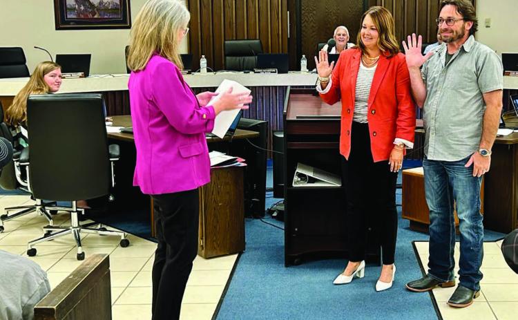 City Clerk Lisa Lasyone (pictured left) swears in Ward 4 Commissioner Ashley Fichtner (center) and Ward 3 Commissioner Chris Odneal (right). Photo provided by City of Shawnee