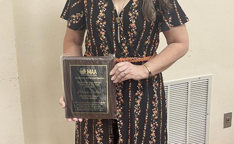 Macomb High School Math Teacher Sharon Spikes poses with her Mathematical Association of America Oklahoma Teacher of the Year Award. Photo provided.