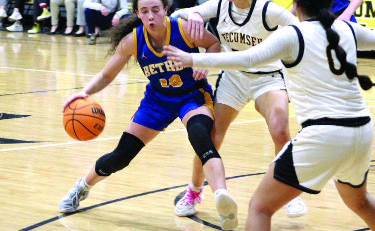 Bethel’s Parker Stevenson makes her way toward the basket before eventually making a three-pointer in the second quarter of the game at Tecumseh on Feb. 3. The Lady Savages lost, 42-56. Countywide &amp; Sun/Natasha Dunagan