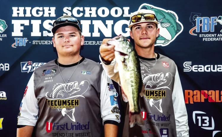 Tecumseh High School incoming junior Alex Hurst and 2026 graduate Maddox Dickson pose with one of the bass they caught in the recent 17th Annual SAF HS Fishing National Championship and World Finals in Kentucky. Photo provided