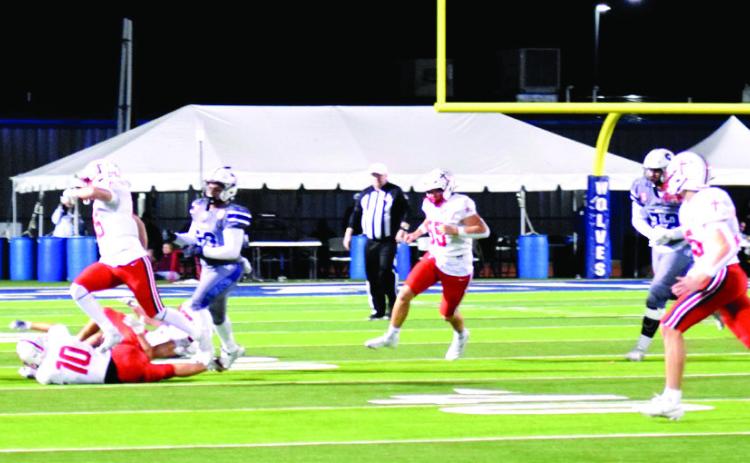 Braylon Lassiter makes the run for a first down in the Halloween home game against Bishop Kelley. The Wolves were tied until the last few seconds when the Comets kicked a field goal for the 27-30 win. Julie Talton, Countywide &amp; Sun