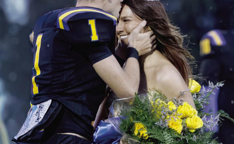 Bethel High School Homecoming Queen Rylan Freeman gets a kiss on the forehead by senior Stonie Holliday after the coronation on Oct. 15. Photos courtesy of Richelle Treece/181 Photographs