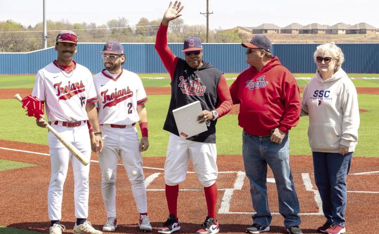 Pictured from left, SSC sophomores Kendall McDowell and Wilfred Gonzalez, Head Coach Mack Chambers, Board of Regents Chair Curtis Morgan and President Lana Reynolds gather on Lloyd Simmons Field to honor Chambers for his 200th win as head coach of the Trojans. Photo provided