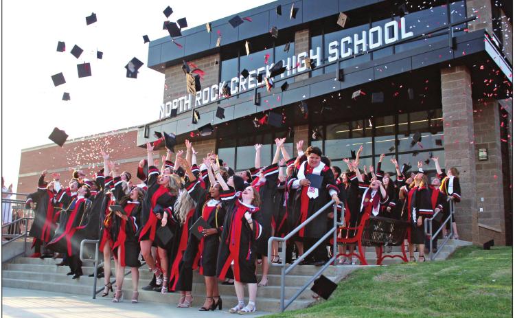 Following the Graduation Ceremony in the gym on May 19, North Rock Creek High School’s first-ever graduating class of 88 seniors tossed their hats on the entrance steps. Countywide &amp; Sun/Natasha Dunagan