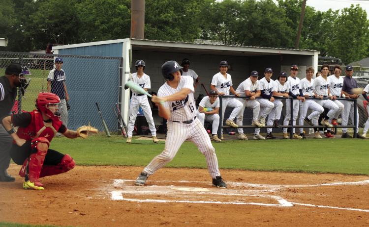 Asher sophomore Daniel Vance tags a triple during the first inning of the Class B District Baseball Tournament home game against Macomb on April 22. Also shown is Macomb catcher, senior Radlee Blaine. The Indians won both games that day, 26-0 and 20-0, to become District Champions. Photos by Natasha Dunagan, Countywide & Sun
