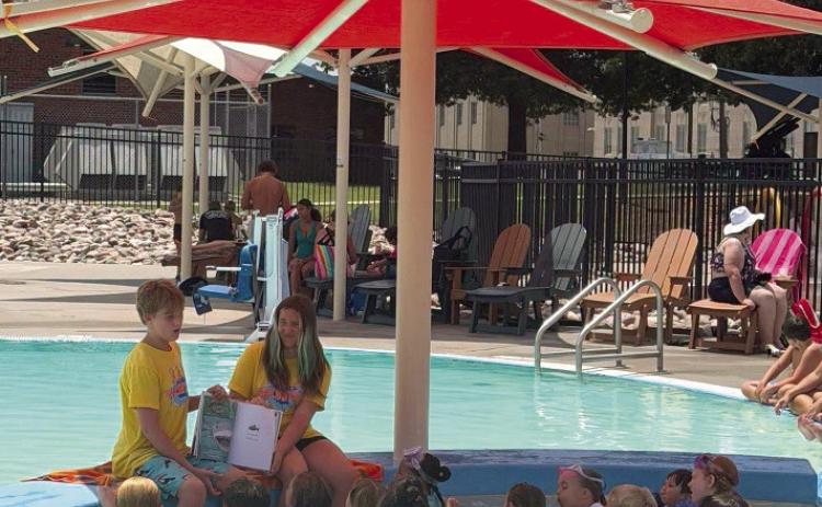Pictured leading story time at Splash this summer are Youth Volunteers Litton Stone and Ellie Welch. Photo Provided